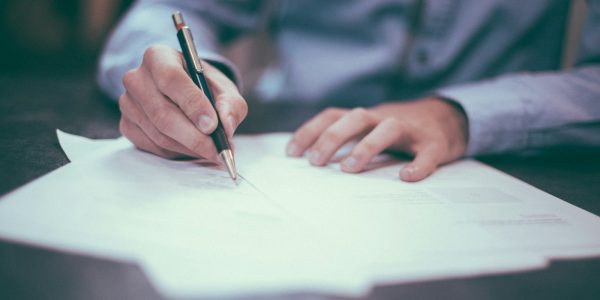 Homeowner reviewing a remodeling contract with a San Antonio contractor