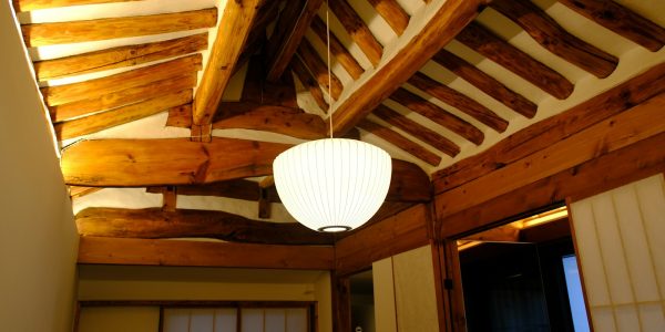 Wood-paneled ceiling with ceiling fan illustrating attic ventilation and insulation in a San Antonio home