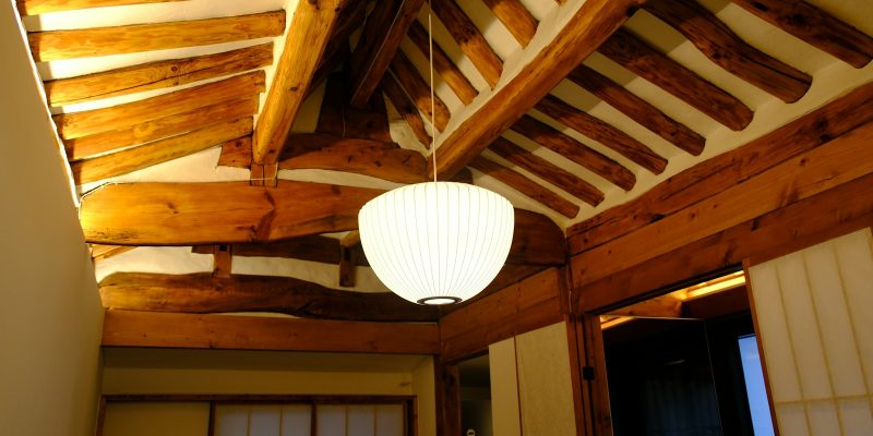 Wood-paneled ceiling with ceiling fan illustrating attic ventilation and insulation in a San Antonio home