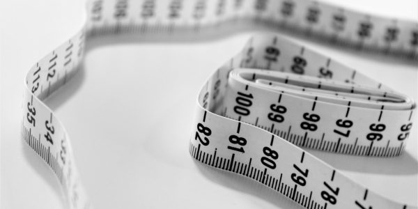 Tape measure representing careful planning to avoid common remodeling mistakes in San Antonio