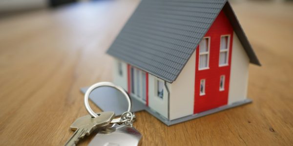 Miniature house model representing home financing and remodel loan options in San Antonio